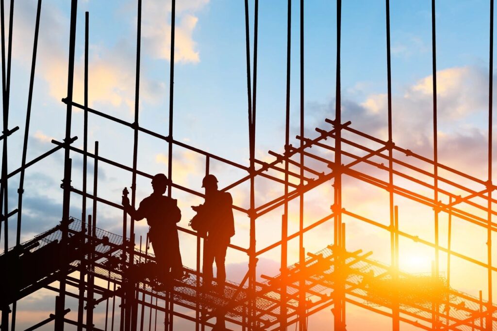 construction workers working in the framing of a building